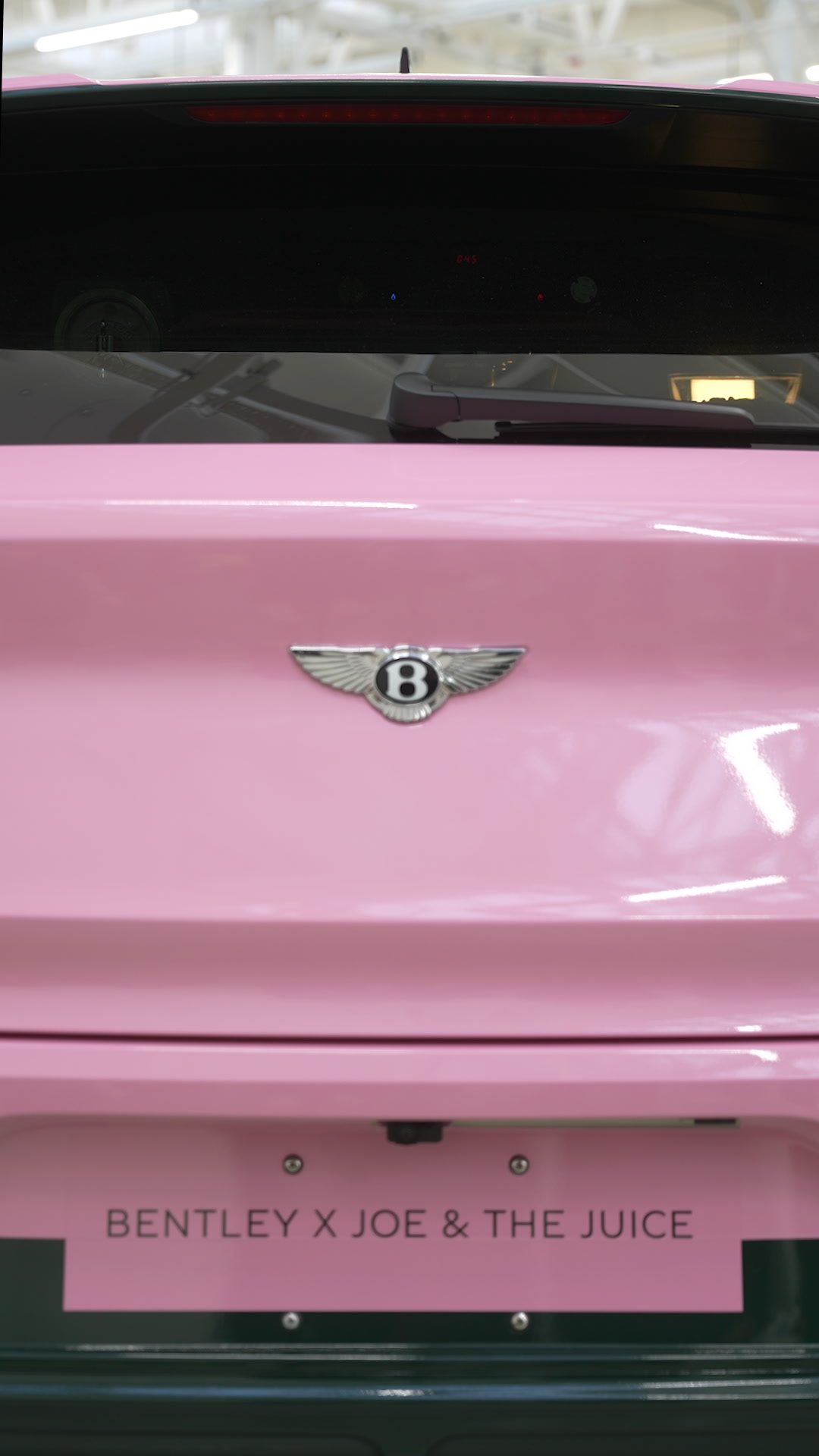 The rear of the car: Bentley badge and the Bentley × Joe & The Juice plate